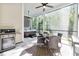 Screened patio with ceiling fans, a dining area, outdoor grill, and a relaxing hot tub at 212 Starlit Way, Myrtle Beach, SC 29579
