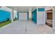 Spacious ground level garage area with white door, offering ample parking and storage at 2308 Seaseeker Ln., Myrtle Beach, SC 29577