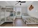 Charming bedroom featuring bunk beds and twin bed with vibrant, coastal themed bedding at 2310 Seaseeker Ln., Myrtle Beach, SC 29577