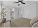 Bright bedroom with hardwood floors features a ceiling fan, a rug, bathroom and closet at 2310 Seaseeker Ln., Myrtle Beach, SC 29577