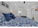 Relaxing bedroom with a ceiling fan and patterned bedding, offering a serene and cozy atmosphere at 2310 Seaseeker Ln., Myrtle Beach, SC 29577