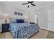 Comfortable bedroom featuring neutral walls, a ceiling fan, and a bed with patterned bedding at 2310 Seaseeker Ln., Myrtle Beach, SC 29577
