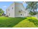 View of the back of the house showing the covered patio and grassy yard at 2426 Park St., North Myrtle Beach, SC 29582