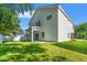 Spacious backyard showcases well-maintained lawn, vinyl siding, and covered patio at 2426 Park St., North Myrtle Beach, SC 29582