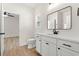 Charming bathroom with white vanity, black hardware, and a rectangular framed mirror at 2426 Park St., North Myrtle Beach, SC 29582