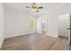 Bedroom featuring modern ceiling fan, vinyl floor, and natural light from window at 2426 Park St., North Myrtle Beach, SC 29582