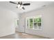 Sunlit bedroom offers a ceiling fan, wood-look floors, and a charming view at 2426 Park St., North Myrtle Beach, SC 29582