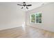Bright bedroom features a ceiling fan, wood-look flooring, and a sun-filled window at 2426 Park St., North Myrtle Beach, SC 29582