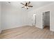 Bedroom with wood-look flooring, decorative paneling, and an ensuite bathroom at 2426 Park St., North Myrtle Beach, SC 29582