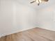 Bedroom featuring wood-look floors, neutral walls, ceiling fan, and a door with a view into the hallway at 2426 Park St., North Myrtle Beach, SC 29582