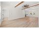 Bright and airy living room with exposed ceiling beams and wood-look flooring at 2426 Park St., North Myrtle Beach, SC 29582