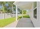 Covered outdoor patio with white support columns, concrete floor, and view of backyard at 2426 Park St., North Myrtle Beach, SC 29582