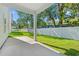 Covered patio offering a view of the fenced backyard and lush green lawn at 2426 Park St., North Myrtle Beach, SC 29582