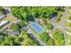 Aerial view showcasing the tennis court with trees at 2426 Park St., North Myrtle Beach, SC 29582