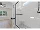 Modern bathroom features a stylish glass enclosed shower with white tile and mosaic floor at 2428 Park St., North Myrtle Beach, SC 29582