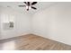Bedroom featuring ceiling fan, natural light, and laminate flooring at 2428 Park St., North Myrtle Beach, SC 29582