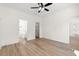 Bedroom with ceiling fan, ensuite bath, and open access to multiple rooms at 2428 Park St., North Myrtle Beach, SC 29582