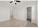 Bedroom with laminate flooring, white trim and doors leading to other rooms at 2428 Park St., North Myrtle Beach, SC 29582