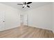 Bright bedroom features stylish wood-look floors and an open doorway leading to the rest of the home at 2428 Park St., North Myrtle Beach, SC 29582