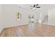 Bright living room with wood floors, staircase, and sliding glass doors that lead to the backyard at 2428 Park St., North Myrtle Beach, SC 29582