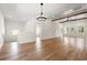 Open floor plan living room with wood floors, beams, and a chandelier at 2428 Park St., North Myrtle Beach, SC 29582