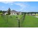 Expansive fenced backyard with a swing set and pond access, perfect for outdoor activities and relaxation at 280 Macarthur Dr., Conway, SC 29527