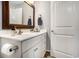 Elegant bathroom featuring a wood-framed mirror, white vanity, and sleek fixtures at 280 Macarthur Dr., Conway, SC 29527