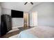 Spacious bedroom featuring a ceiling fan, mounted TV, and private entrance at 280 Macarthur Dr., Conway, SC 29527