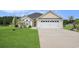 Charming home with a two-car garage, well-manicured lawn, and patriotic American flag at 280 Macarthur Dr., Conway, SC 29527