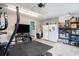 Versatile garage space with a home gym area, refrigerator, and storage at 280 Macarthur Dr., Conway, SC 29527