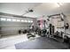 Spacious garage converted into a home gym with various exercise equipment at 280 Macarthur Dr., Conway, SC 29527