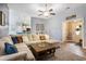 Open-concept living room featuring a comfortable sectional sofa, hardwood floors, and seamless access to the kitchen at 280 Macarthur Dr., Conway, SC 29527