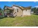 The home features a grassy backyard with a fenced-in yard and brick exterior at 320 Edgewood Circle, Conway, SC 29527
