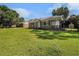 Quaint single-story brick home with a well-kept lawn and a covered porch on a sunny day at 320 Edgewood Circle, Conway, SC 29527