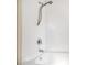 The shower features white tile and a shower head with great water pressure at 320 Edgewood Circle, Conway, SC 29527
