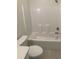 Bathroom featuring a white tub with shower with white walls and a toilet at 3216 Hugo Rd., Conway, SC 29527