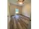 Empty bedroom with wood flooring, neutral walls, and a window at 3216 Hugo Rd., Conway, SC 29527