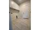 Laundry room with tiled floor, white cabinets, and in-wall hookups at 3216 Hugo Rd., Conway, SC 29527