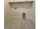 Bright laundry room featuring tile flooring and washer-dryer hookups at 3216 Hugo Rd., Conway, SC 29527