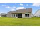 Well-maintained backyard featuring a screen porch, lawn, and neutral vinyl siding at 3217 Shadow Pine Ct., Myrtle Beach, SC 29579