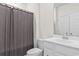 Clean bathroom with white cabinets, mirror, and shower curtain at 3217 Shadow Pine Ct., Myrtle Beach, SC 29579