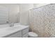 Bathroom featuring a white cabinet, mirror, and patterned shower curtain at 3217 Shadow Pine Ct., Myrtle Beach, SC 29579