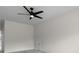 Large bedroom with a neutral color scheme, ceiling fan, and door to another room at 3217 Shadow Pine Ct., Myrtle Beach, SC 29579