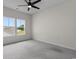 Bedroom featuring neutral carpet, natural light from the windows, and a ceiling fan at 3217 Shadow Pine Ct., Myrtle Beach, SC 29579