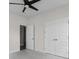 Neutral bedroom featuring a ceiling fan and a double door closet at 3217 Shadow Pine Ct., Myrtle Beach, SC 29579