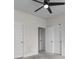 Neutral bedroom featuring a ceiling fan and multiple closets at 3217 Shadow Pine Ct., Myrtle Beach, SC 29579