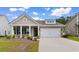 Inviting single-story home with a two-car garage, charming columns, and a well-manicured lawn at 3217 Shadow Pine Ct., Myrtle Beach, SC 29579