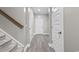 Hallway featuring wood-look floors, a staircase, and neutral wall paint at 3217 Shadow Pine Ct., Myrtle Beach, SC 29579