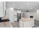 Open-concept kitchen with a large island, stainless steel appliances, and eat in bar at 3217 Shadow Pine Ct., Myrtle Beach, SC 29579