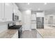 Kitchen with white cabinets, granite countertops, stainless steel appliances, and an island at 3217 Shadow Pine Ct., Myrtle Beach, SC 29579